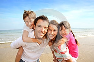 Familly standing on the beach