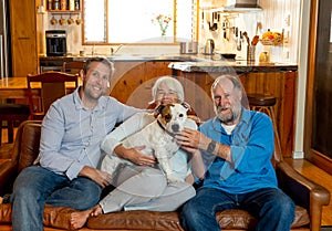 Family relaxing at home and loving their pet. Positive image of life at home and New Normal