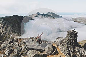 Family adventurers with baby on the top of mountain