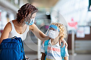 Family in airport in face mask. Virus outbreak