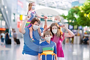 Family in airport in face mask. Virus outbreak