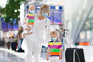 Family in airport in face mask. Virus outbreak