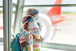 Family in airport in face mask. Virus outbreak