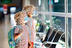 Family in airport in face mask. Virus outbreak