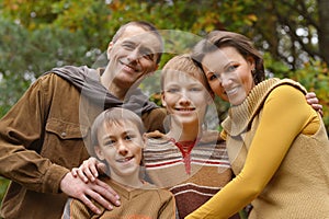 Family in autumn forest