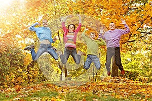 Family in autumn forest