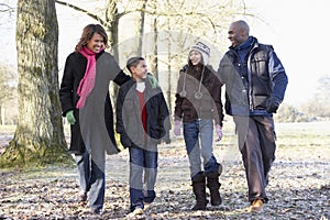 Family On Autumn Walk In Countryside