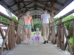 Family with baby on bridge