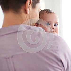 Family, baby and face with dad in home with love, support and care together with parent and bonding. Relax, father and