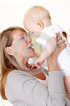 Family, baby and grandma playing with smile in home for motor development and growth in Australia. Happiness