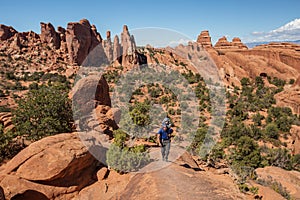 A family with baby son visits Arches National Park in Utah, USA