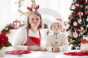 Family baking Christmas cookies. Kids Xmas fun