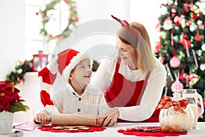 Family baking Christmas cookies. Kids Xmas fun