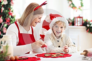 Family baking Christmas cookies. Kids Xmas fun