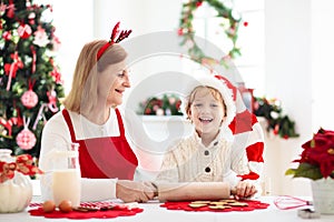 Family baking Christmas cookies. Kids Xmas fun