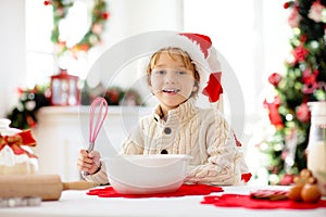 Family baking Christmas cookies. Kids Xmas fun