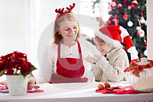 Family baking Christmas cookies. Kids Xmas fun