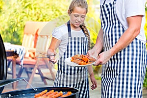 Family barbecue together on terrace