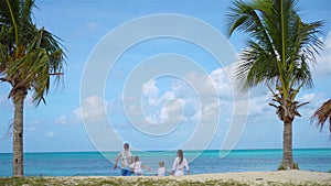 Family on the beach on caribbean vacation.