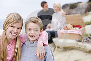 Family at beach with picnic