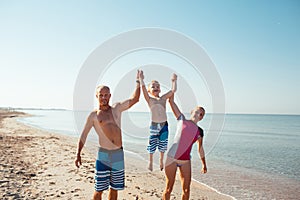 Family on the beach at sunset