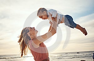 Family, beach and sunset vacation with mother and lifting child in air for fun, love and care with support. Woman and