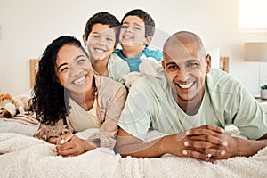 Family, bed and portrait of parents and kids bonding in a bedroom in a house and playing together. Smile, mother and