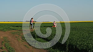 Family on bicycles. A woman with a child on a ride on bicycles. Lifestyle. Healthy lifestyle. Sport family.