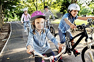 Family on a bike ride in the park photo