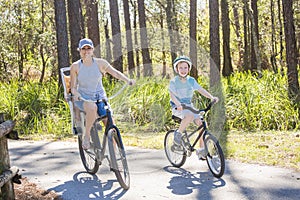 Family on a bike ride together outdoors on a sunny day