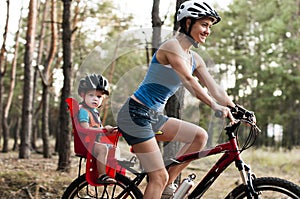 Family biking in the forest.