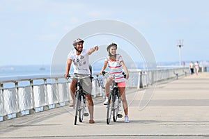 Family on a biking journey on the seaside