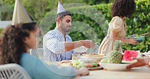 Family, birthday party and lunch in garden for children, parents and celebration at table with giving food. Man, woman