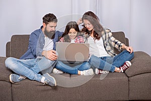 family blog. happy parents with kid girl study online. mom dad and daughter shopping