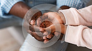 Family bonding. African American grandfather and child holding hands together, closeup. Panorama