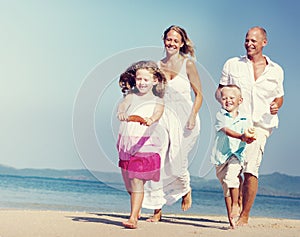 Family Bonding Running Sand Beach Summer Concept
