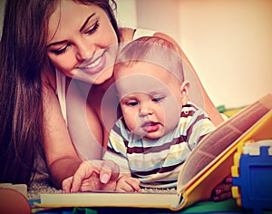 Family book read with mother and baby. Early reading develops children.