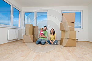 Family with boxes in new home