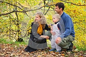 Family with boy in autumn park