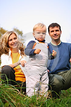 Family with boy in grass