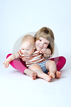 Family, brother and sister hugging