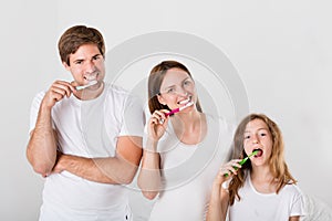 Family Brushing Teeth Together