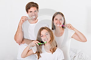 Family Brushing Teeth Together photo