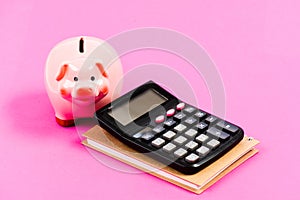 Family budget management. business start up. saving money. First salary. piggy bank with calculator. Moneybox