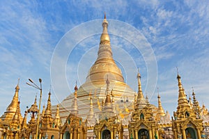 Family burmese people praying respects at Shwedagon big golden pagoda in rangoon, MyanmarBurma
