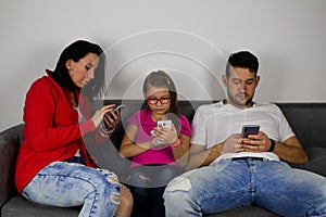 Family busy with mobile phones