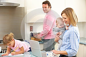 Family busy together in kitchen