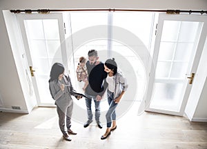 Family buying new house together photo