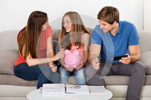 Family Calculating Bills At Home