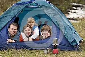 Family camping in tent